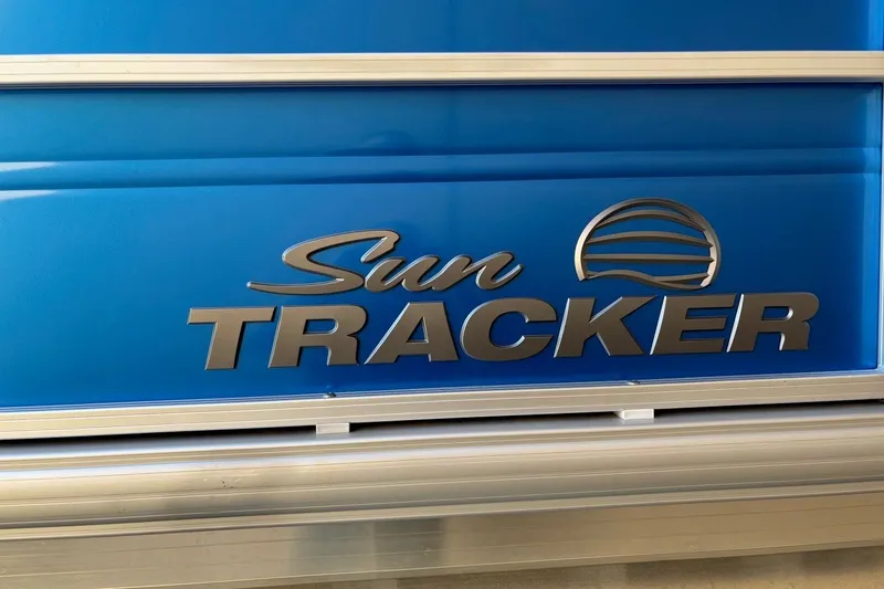 Slide: The Image of 2026 Sun Tracker Party Barge 16 DLX logo on blue background. - 7