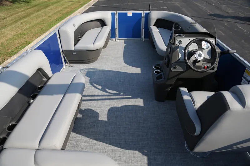 Slide: The Image of 2026 Sun Tracker Party Barge 16 DLX interior with spacious seating and modern helm. - 4