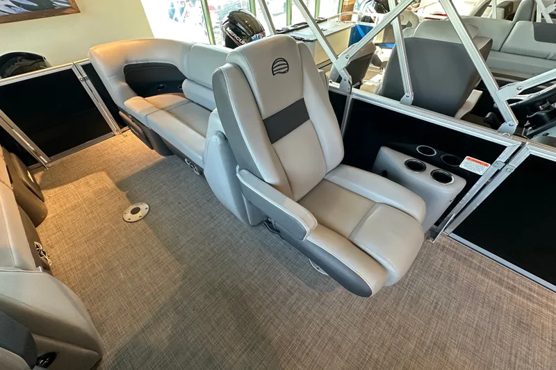 Slide: The Image of 2026 Sun Tracker Party Barge 22 XP3 interior with plush seating and cup holders. - 16
