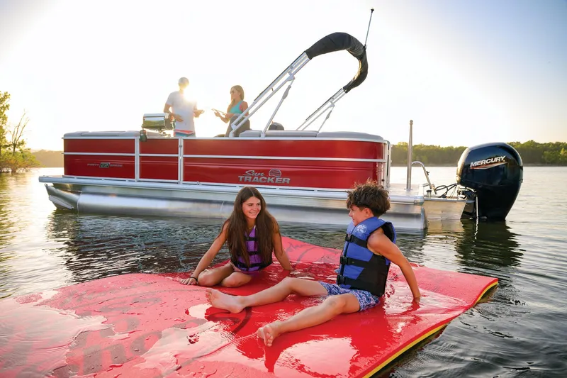 Slide: The Image of 2026 Sun Tracker Party Barge 22 DLX pontoon boat with spacious seating and modern design. - 5