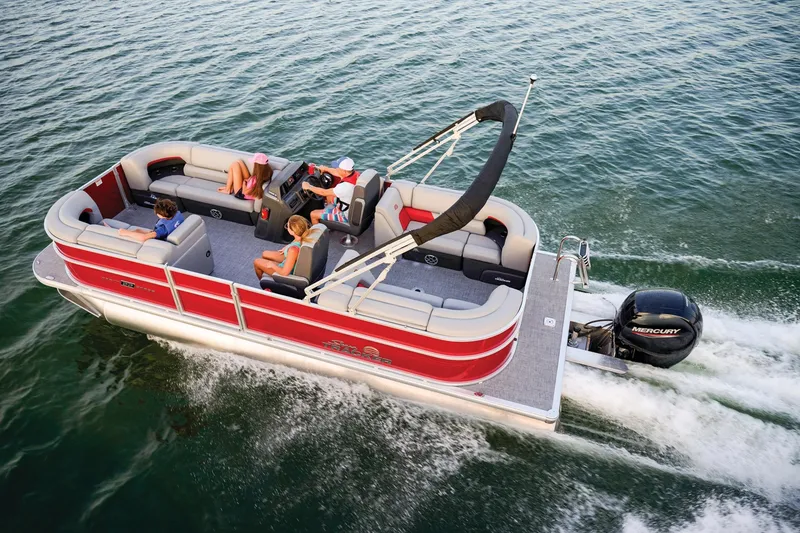 Slide: The Image of 2026 Sun Tracker Party Barge 22 DLX storage compartment with open seat and visible interior. - 8