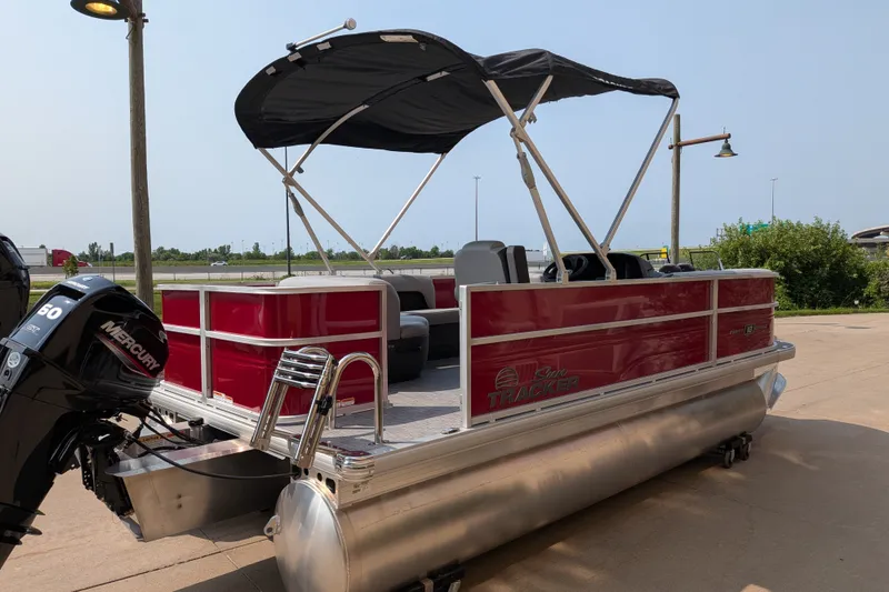 The Image of 2026 Sun Tracker Party Barge 18 DLX pontoon boat with Mercury outboard motor. - 0