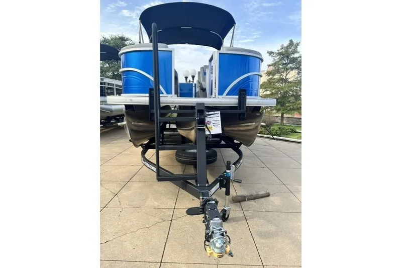 Slide: The Image of 2026 Sun Tracker Party Barge 22 XP3 pontoon boat on trailer, displayed outdoors. - 9