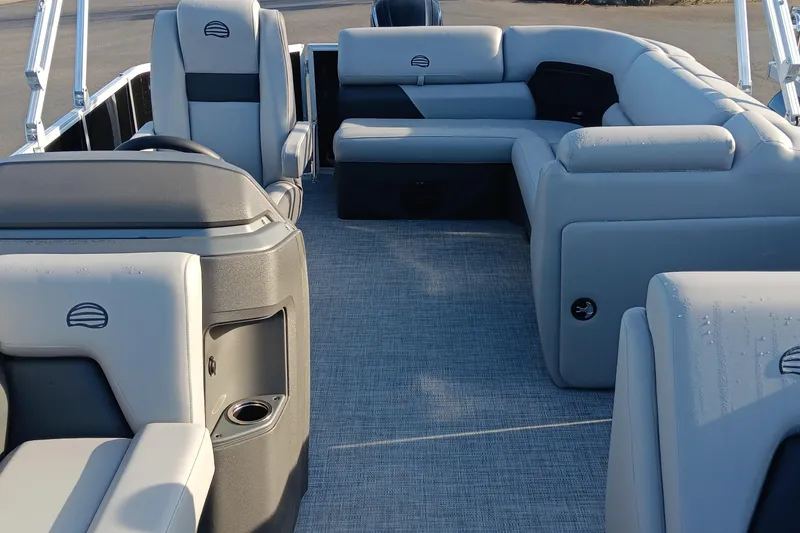 Slide: The Image of 2026 Sun Tracker Party Barge 20 DLX interior with gray seating and spacious layout. - 75