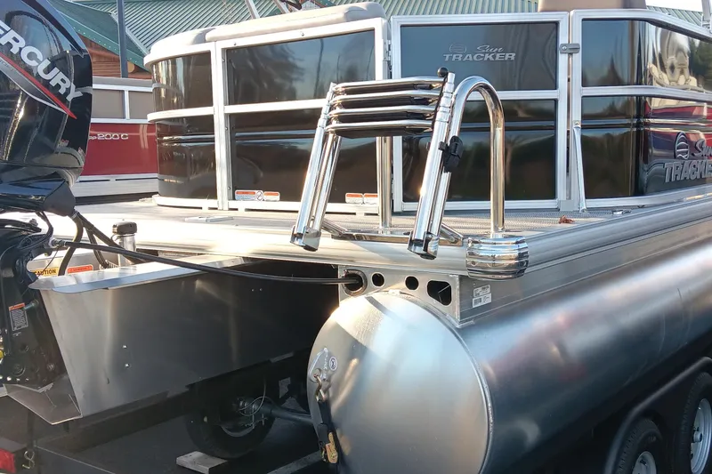 Slide: The Image of 2026 Sun Tracker Party Barge 20 DLX pontoon boat with Mercury outboard motor. - 76