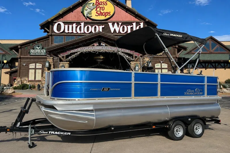 The Image of 2026 Sun Tracker Party Barge 18 DLX pontoon boat at Bass Pro Shops Outdoor World. - 0