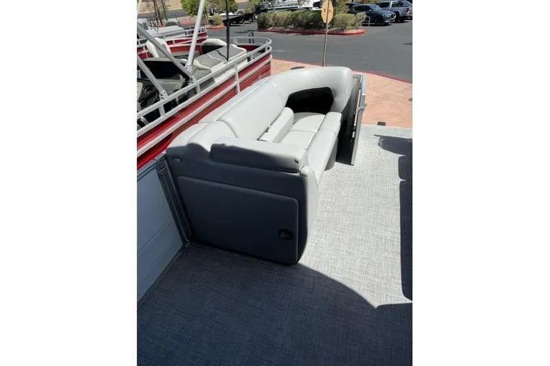 Slide: The Image of 2026 Sun Tracker Party Barge 20 DLX with gray seating on deck. - 6