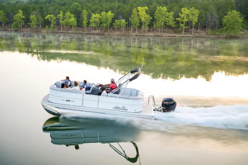 Slide: The Image of 2026 Sun Tracker Party Barge 20 DLX pontoon boat, rear view with motor and canopy. - 3