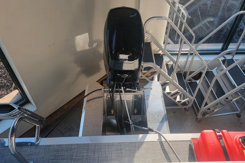 Slide: The Image of Sun Tracker Party Barge 16 DLX 2026 boat engine and deck view. - 4