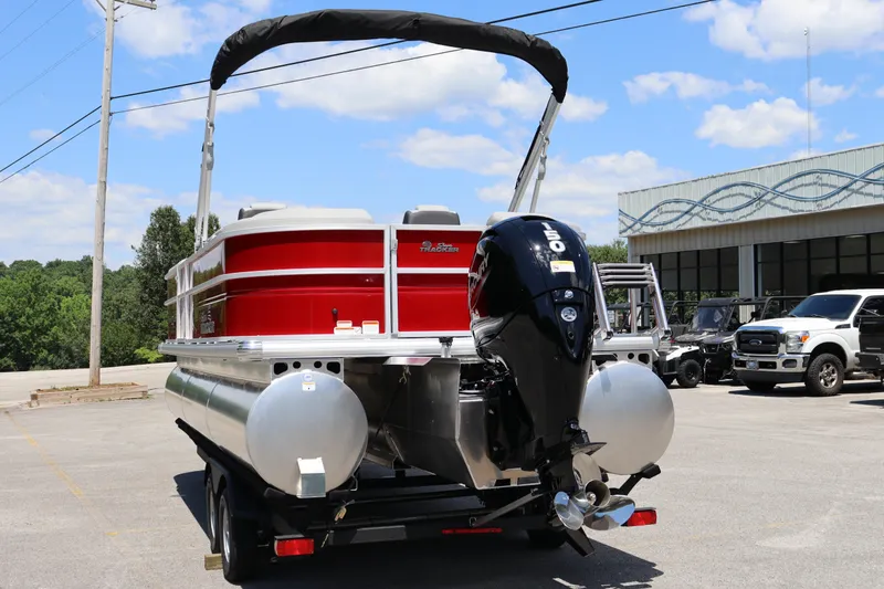 Slide: The Image of 2026 Sun Tracker Party Barge 22 XP3 pontoon boat with outboard motor in parking lot. - 15