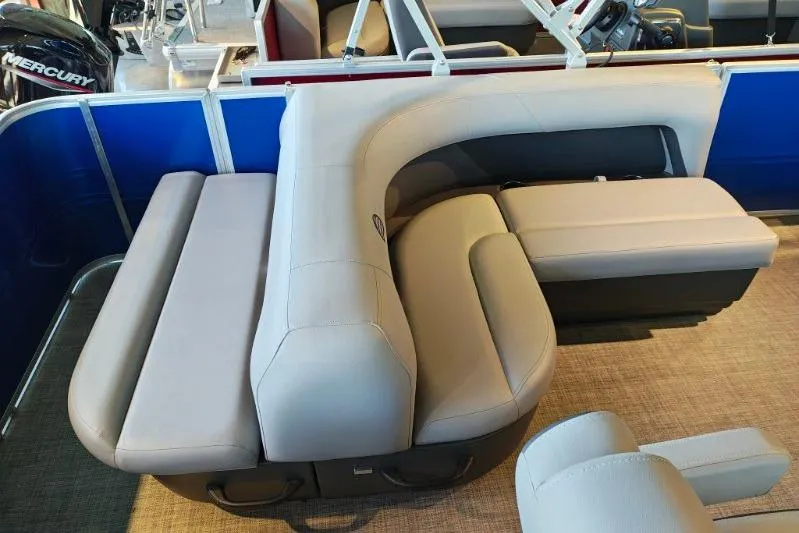 Slide: The Image of 2026 Sun Tracker Party Barge 18 DLX interior with plush seating and modern design. - 13