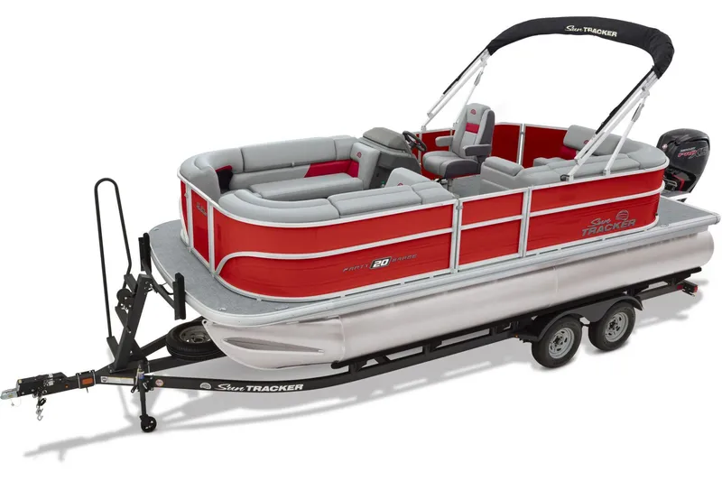 Slide: The Image of 2026 Sun Tracker Party Barge 20 DLX pontoon boat on trailer in parking lot. - 5