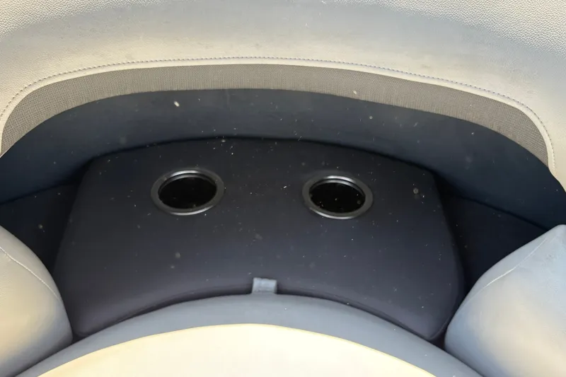 Slide: The Image of Cup holders on Sun Tracker Party Barge 20 DLX, 2026 model, boat seating area. - 24