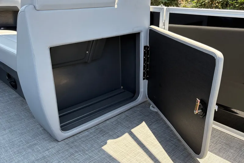 Slide: The Image of Open storage compartment on 2026 Sun Tracker Party Barge 20 DLX pontoon boat. - 40
