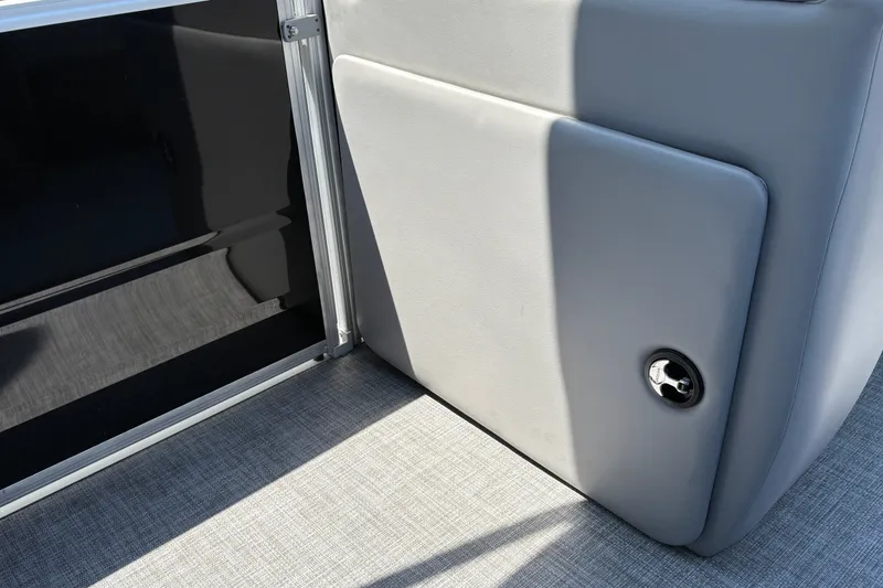 Slide: The Image of 2026 Sun Tracker Party Barge 20 DLX interior detail with sleek gray upholstery. - 41