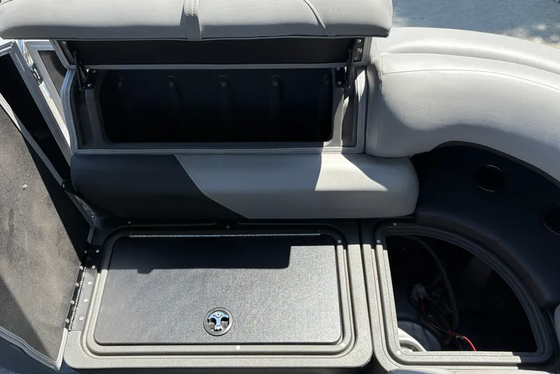Slide: The Image of Open storage compartments on a 2026 Sun Tracker Party Barge 20 DLX pontoon boat. - 34