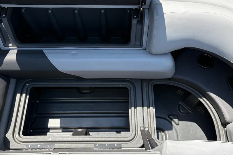 Slide: The Image of 2026 Sun Tracker Party Barge 20 DLX storage compartments, showcasing spacious interior design. - 17