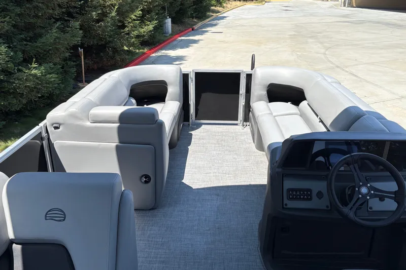 Slide: The Image of 2026 Sun Tracker Party Barge 20 DLX interior with spacious seating and modern helm. - 32