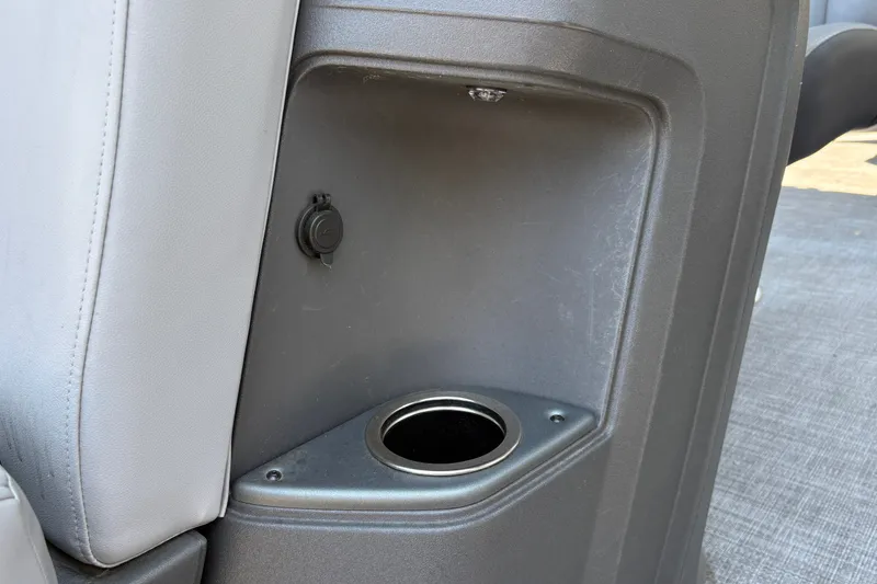Slide: The Image of Cup holder and USB port on 2026 Sun Tracker Party Barge 20 DLX boat. - 31