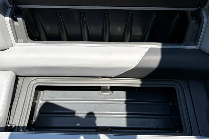 Slide: The Image of Open storage compartment on 2026 Sun Tracker Party Barge 20 DLX pontoon boat. - 23