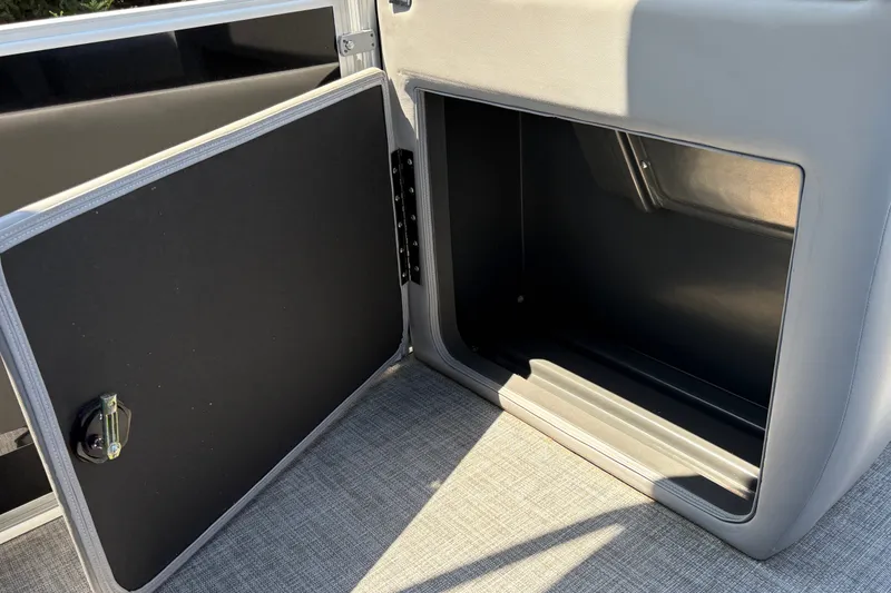 Slide: The Image of Open storage compartment on 2026 Sun Tracker Party Barge 20 DLX pontoon boat. - 39