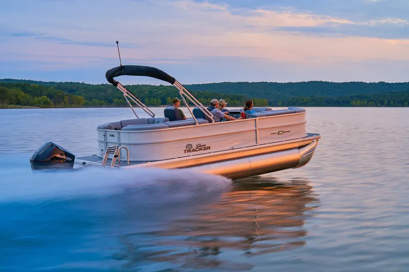 Slide: The Image of 2026 Sun Tracker Party Barge 22 XP3 steering console with modern controls and seating. - 4