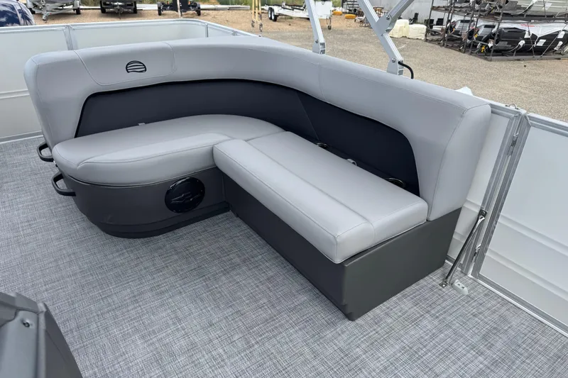 Slide: The Image of 2026 Sun Tracker Party Barge 16 DLX interior seating, featuring gray cushioned seats and modern design. - 14