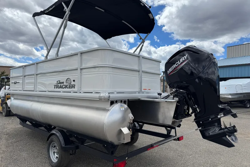 Slide: The Image of 2026 Sun Tracker Party Barge 16 DLX pontoon boat with Mercury outboard motor. - 4