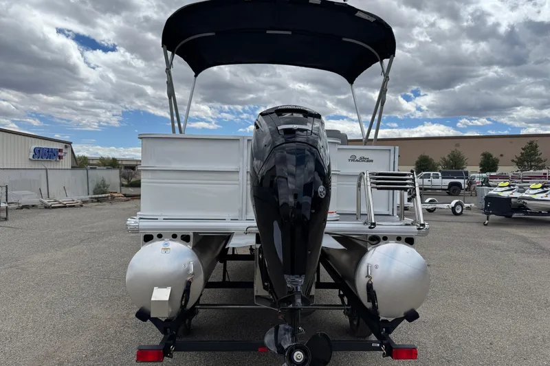 Slide: The Image of 2026 Sun Tracker Party Barge 16 DLX pontoon boat with outboard motor and canopy. - 5