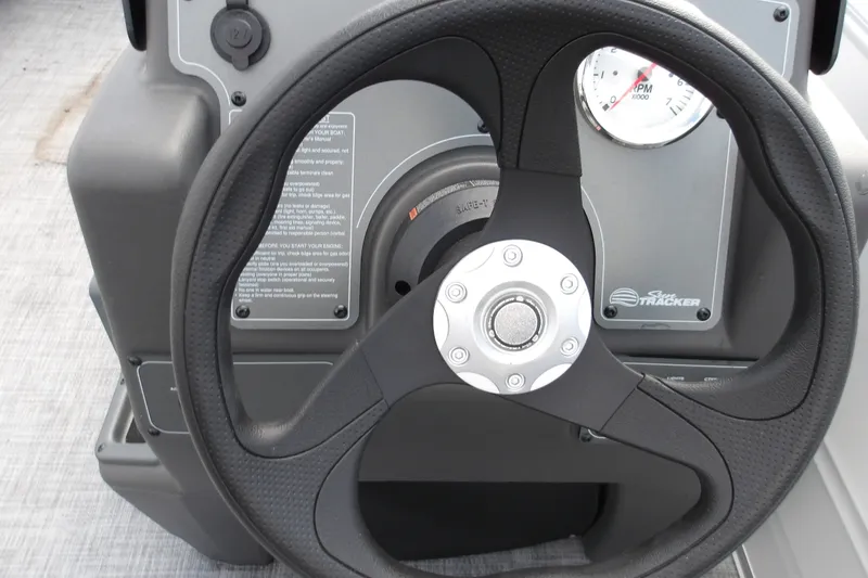 Slide: The Image of Steering wheel of 2026 Sun Tracker Party Barge 16 DLX with RPM gauge. - 18