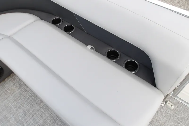 Slide: The Image of 2026 Sun Tracker Party Barge 16 DLX seating with integrated cup holders. - 16