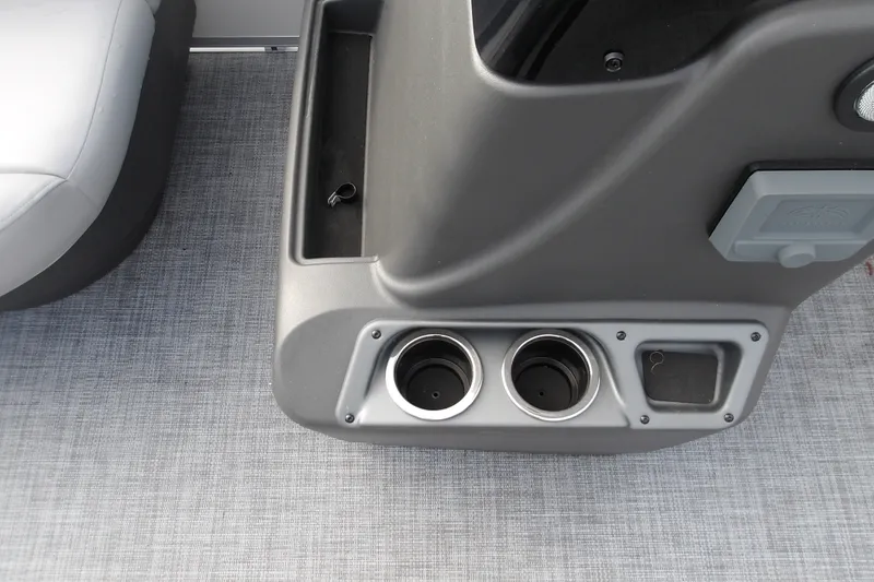 Slide: The Image of 2026 Sun Tracker Party Barge 16 DLX console with cup holders and storage compartment. - 14
