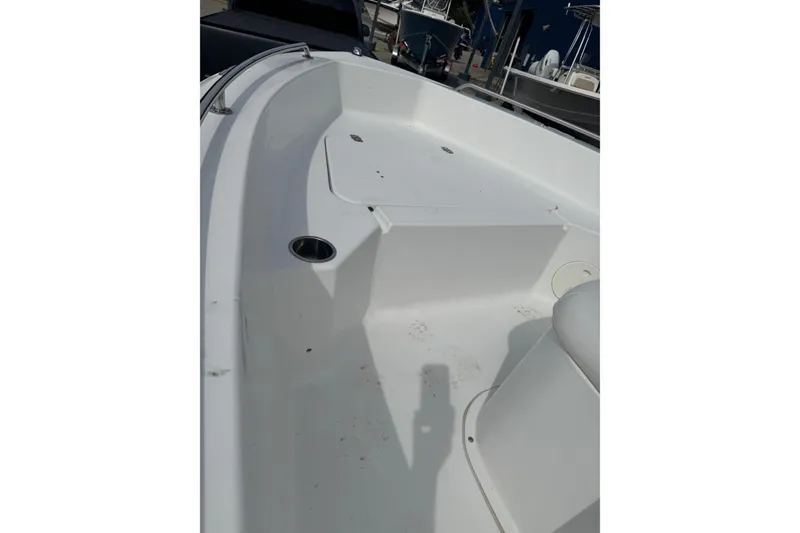 Slide: The Image of 2011 Sea Hunt Triton 177 boat interior, featuring a clean, white deck and seating area. - 5