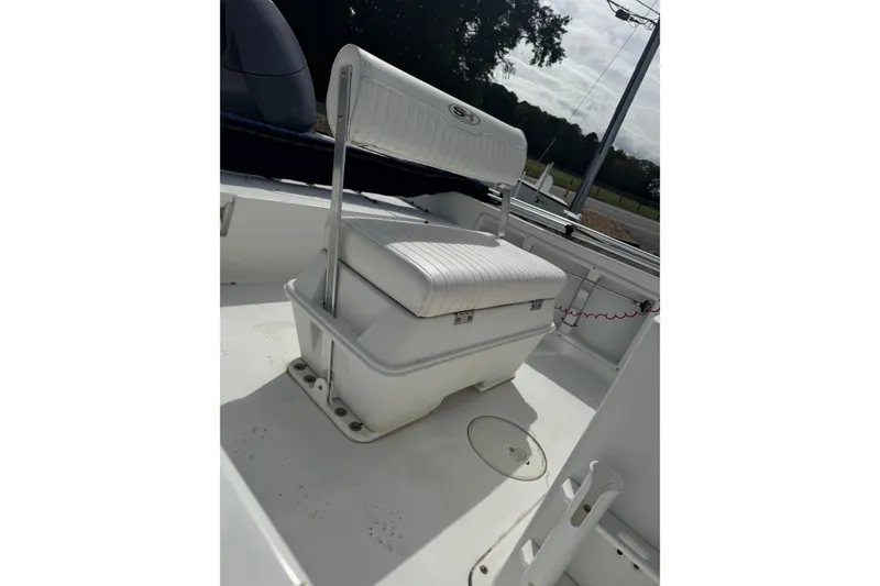 Slide: The Image of 2011 Sea Hunt Triton 177 boat interior with white cushioned seating. - 7