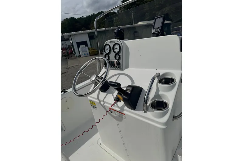 Slide: The Image of 2011 Sea Hunt Triton 177 boat console with steering wheel and gauges. - 8