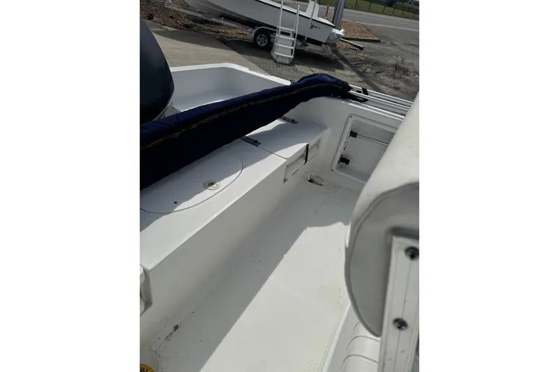 Slide: The Image of 2011 Sea Hunt Triton 177 boat interior with seating and storage compartments. - 9