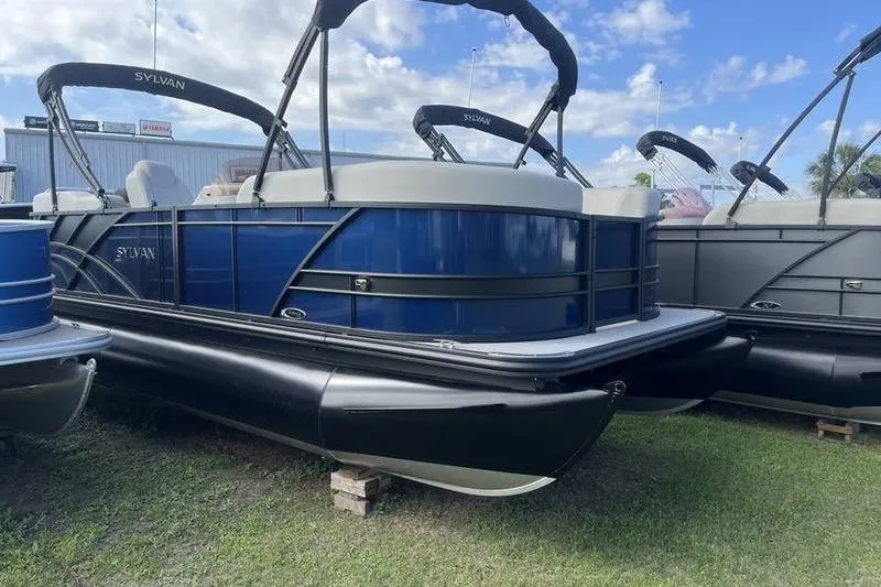 The Image of 2025 Sylvan Mirage 822 LZ pontoon boat with blue and black design on display. - 0