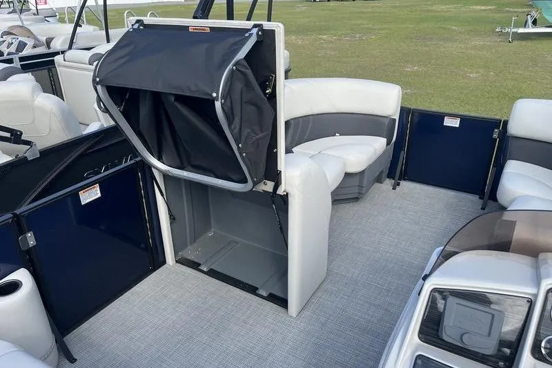 Slide: The Image of 2025 Sylvan Mirage 822 LZ pontoon boat interior with seating and storage area. - 11