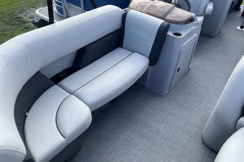 Slide: The Image of 2025 Sylvan Mirage 822 LZ pontoon boat interior with plush seating. - 14
