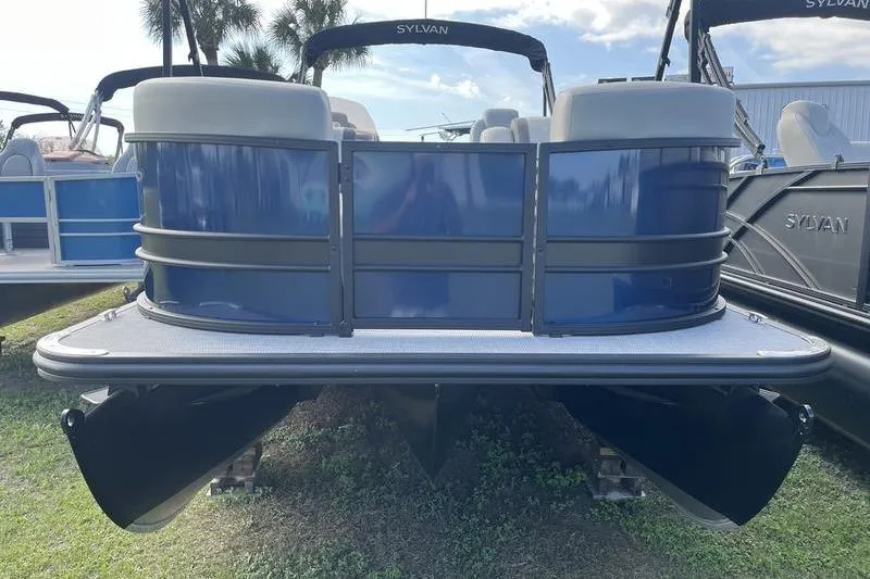 Slide: The Image of 2025 Sylvan Mirage 822 LZ pontoon boat, blue exterior, displayed outdoors. - 2