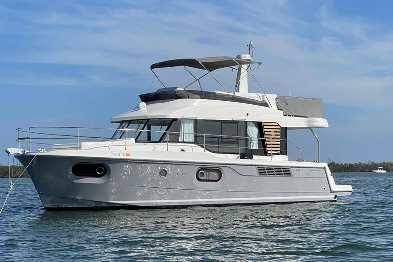The Image of 2025 Beneteau Swift Trawler 41 Fly on calm water, showcasing sleek design and modern features. - 0