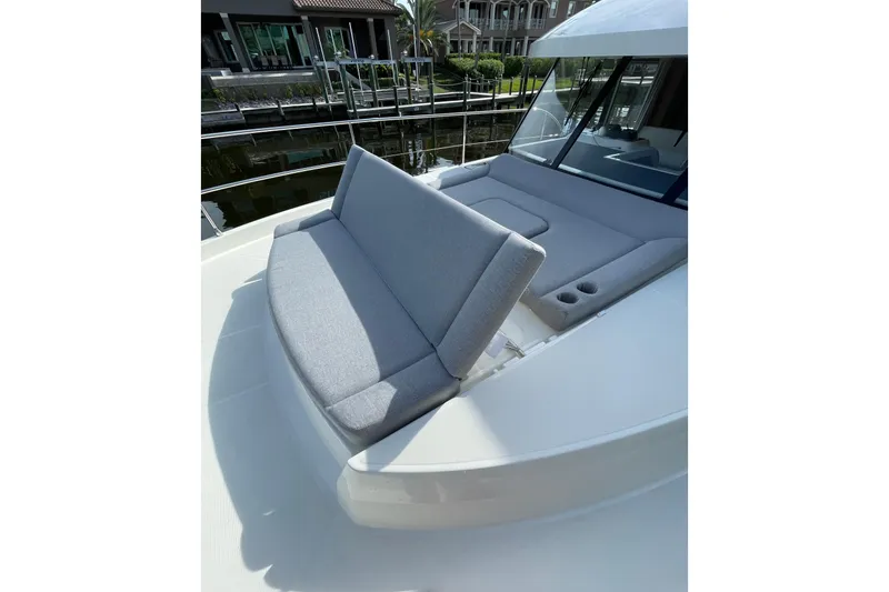 Slide: The Image of 2025 Beneteau Swift Trawler 41 Fly with comfortable deck seating and cup holders. - 18