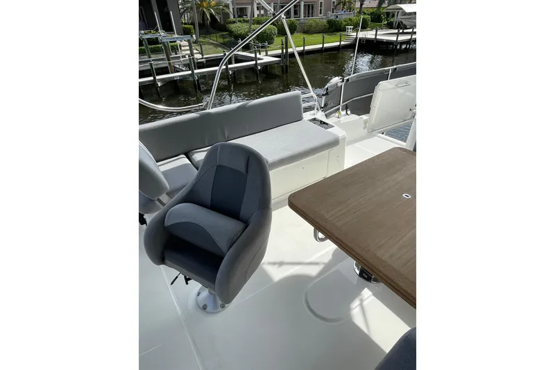 Slide: The Image of 2025 Beneteau Swift Trawler 41 Fly deck with seating and table. - 28