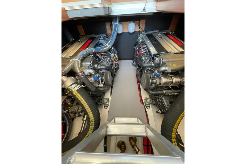 Slide: The Image of Engine room of 2025 Beneteau Swift Trawler 41 Fly, showcasing dual engines and mechanical components. - 38