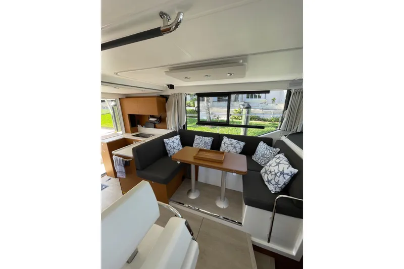 Slide: The Image of Interior of 2025 Beneteau Swift Trawler 41 Fly with modern seating and dining area. - 7