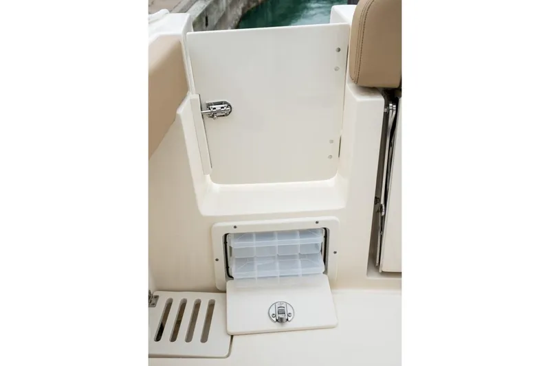 Slide: The Image of 2020 Scout 255 LXF boat with gray and white cushioned seating. - 10