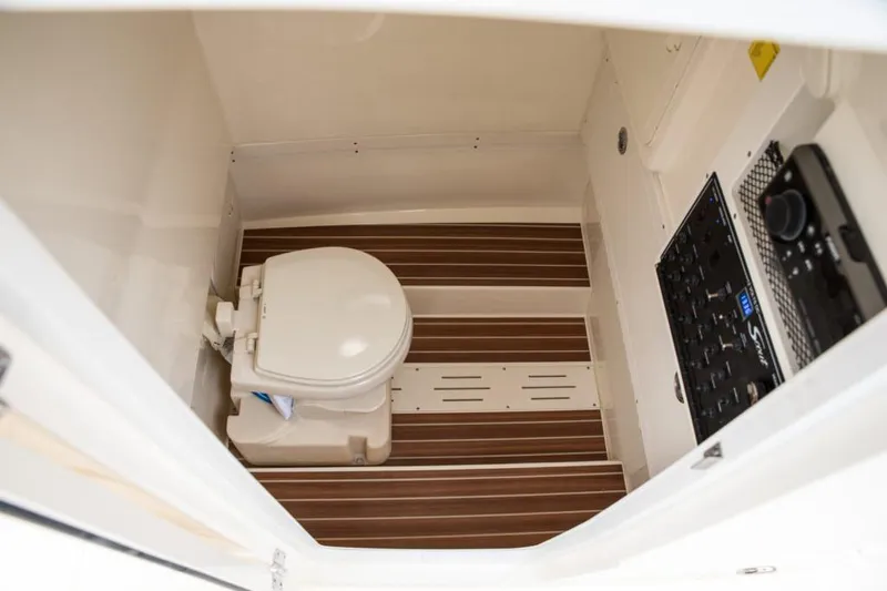 Slide: The Image of 2020 Scout 255 LXF boat interior with seating and cup holders. - 13