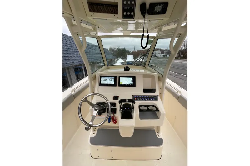 Slide: The Image of 2020 Scout 255 LXF boat helm with modern controls and navigation displays. - 17