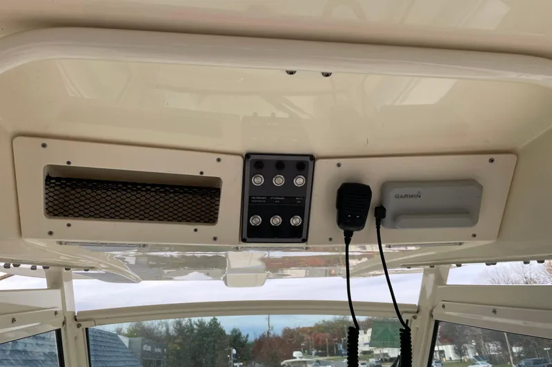 Slide: The Image of 2020 Scout 255 LXF boat dashboard with Garmin device and control panel. - 19