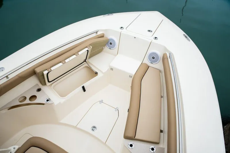 Slide: The Image of 2020 Scout 255 LXF boat interior with storage compartments and seating. - 4